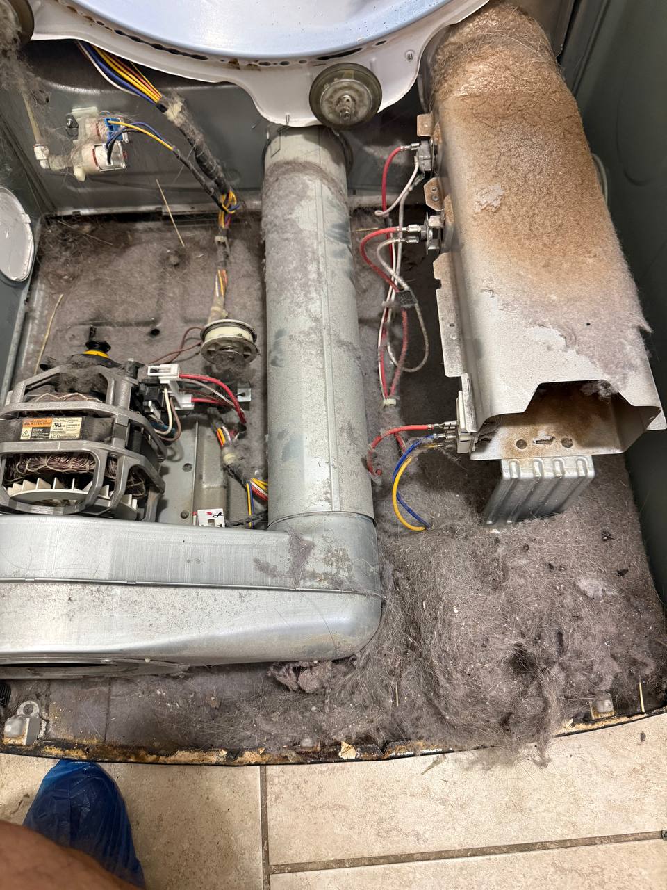 Dryer interior with heavy lint buildup before cleaning - Done Right Appliance Repair