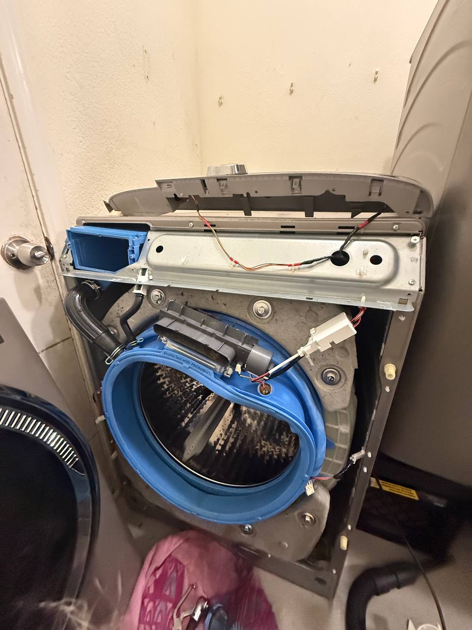 GE front-load washer disassembled for repair - Done Right Appliance Repair